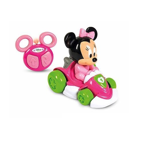 foto della macchina di colore rosa e bianco con le ruote verdi. Minnie alla guida, piu indietro l'immagine del radiocomando.